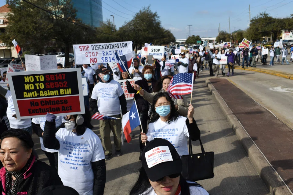 Demonstrators hold a protest in Houston, Texas, against a bill that would forbid Chinese nationals from buying properties in Texas, on Feb 11, 2023. 