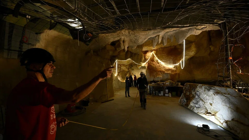 Workers in Marseille, France build an almost life-sized recreation of undersea Stone Age cave paintings found off the coast nearby.