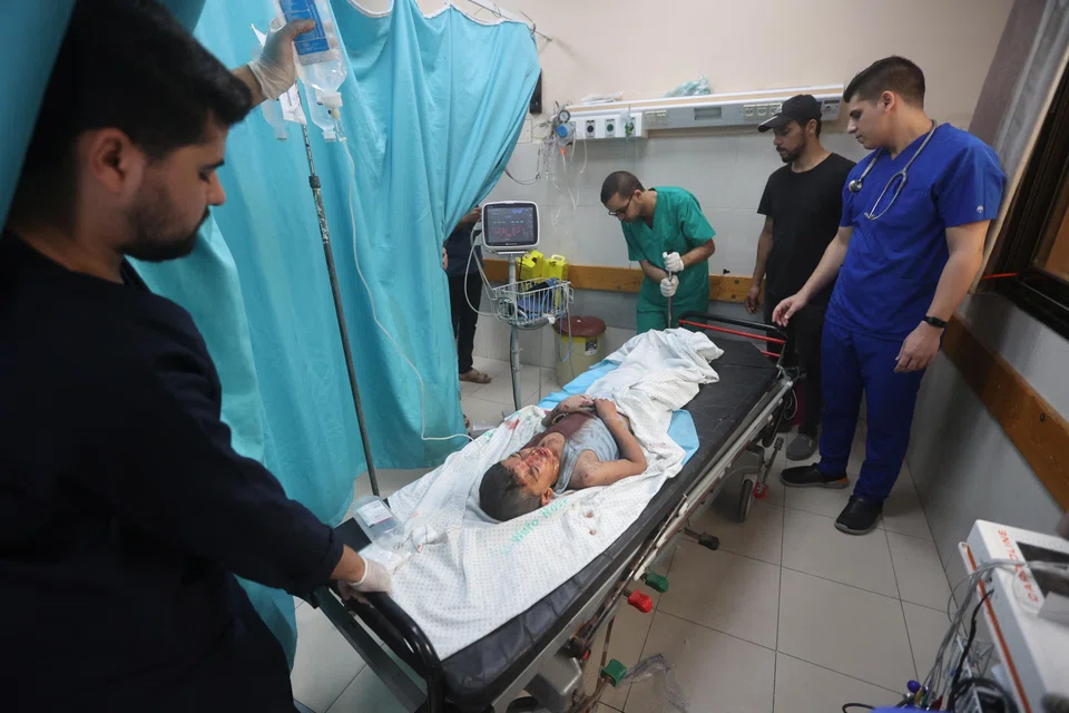 A Palestinian child wounded in Israeli strikes at a hospital in the southern Gaza Strip. The WHO warned that if aid is not allowed into the besieged territory, doctors will have to “prepare death certificates for their patients”.