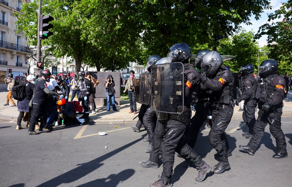 French CRS riot police gather during clashes as part of the traditional May Day labour union march in Paris, France.