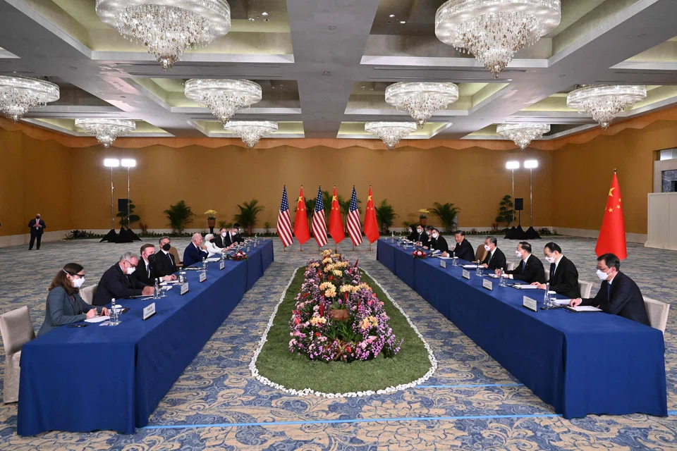 US President Joe Biden and his delegation (left) face ) China's President Xi Jinping and his team on the sidelines of the G20 Summit in Nusa Dua on the Indonesian resort island of Bali on Monday (Nov 14). The talks lasted three hours..  