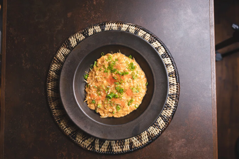 Creamy risotto made with crab fat sourced from shorecrabs in the Philippines.