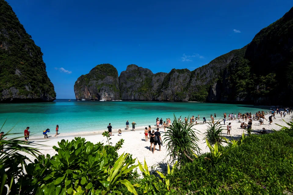 Tourists visit Maya bay after Thailand reopened its world-famous beach after closing it for more than three years to allow its ecosystem to recover from the impact of overtourism, at Krabi province, Thailand, January 3, 2022. Picture taken January 3, 2022. 