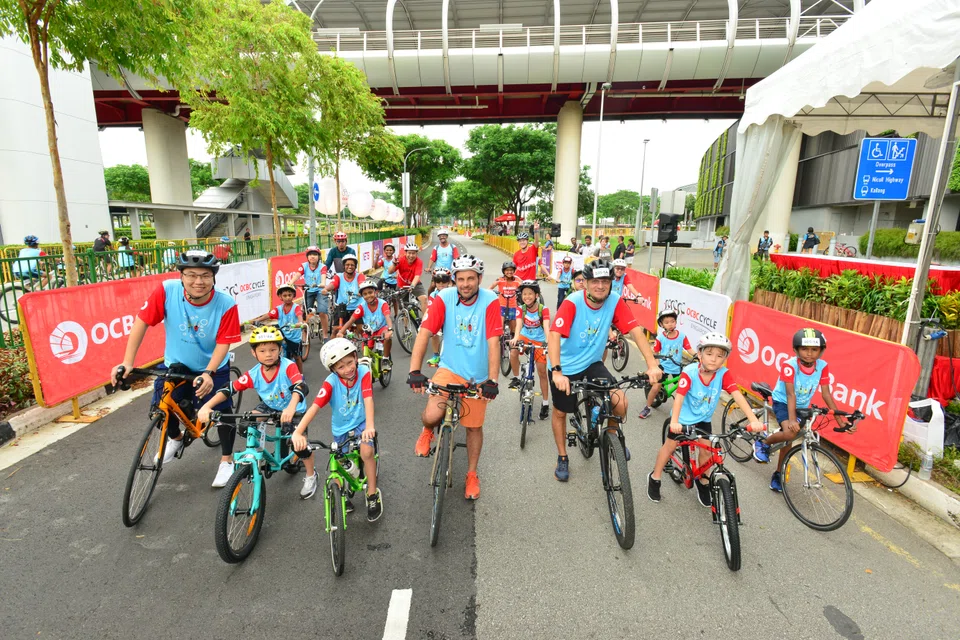Above: Participants at the 5 km Mighty Savers Kids and Family Ride in 2019. The Teach-a-Child-to-Cycle programme will make a comeback this year and teach 20 children from low-income families how to ride a bicycle over three sessions. These children will join the other participants of this year's Mighty Savers Kids Race.