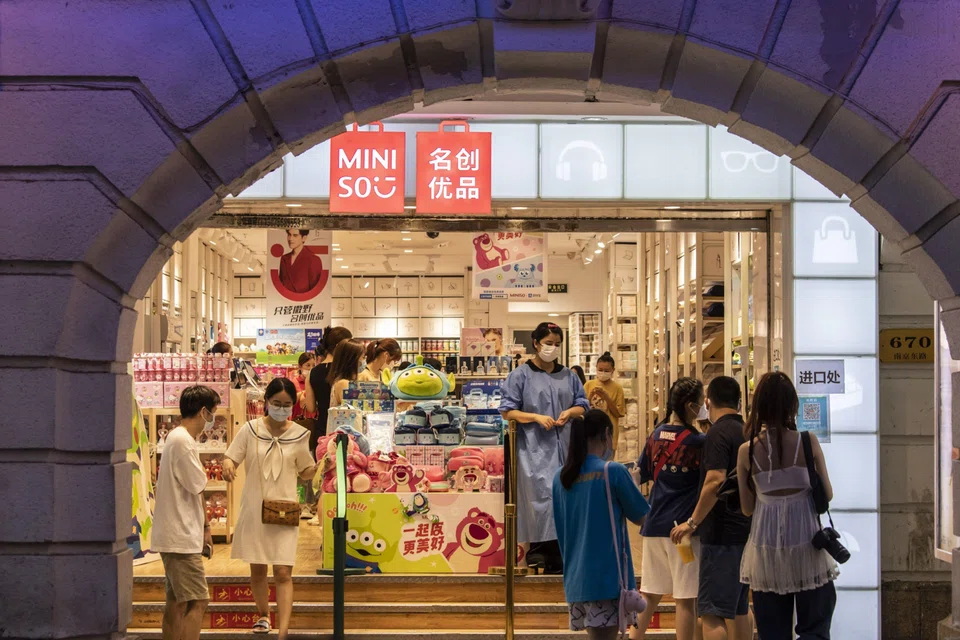Shoppers browsing in the shopping strip in Shanghai. Economists will be tracking consumer trends since consumption has slowed in recent months on the back of waning confidence and a housing market slump. 