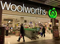 Woolworths Group and Coles Group will likely see growth in their half-year profit, according to analyst estimates, helped by higher shelf prices and lower Covid-19 related costs. 