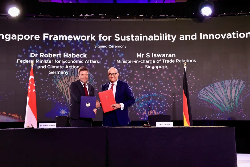 (from left) Germany Federal Minister for Economic Affairs and Climate Action Robert Habeck and Singapore's Minister-in-charge of Trade Relations S Iswaran signing the FSI on Sunday (Nov 13).