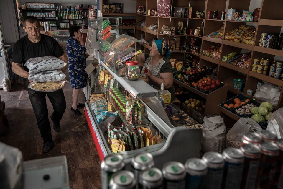 Chaplik delivering goods to a village shop outside Sievierodonetsk, Ukraine, risking the drive in an area routinely hit by artillery shells to help keep it supplied.