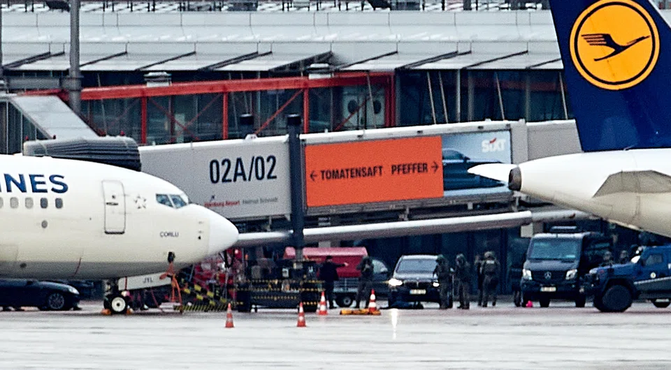 Police secure an area at the airport in Hamburg, Germany, on Nov 5, 2023 after an armed man broke through security and entered its grounds the previous day.