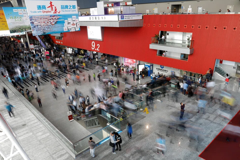 Visitors attend the China Import and Export Fair, also known as Canton Fair, in the southern city of Guangzhou, China, April 16, 2018. This year, 35,000 exhibitors have set up booths over roughly 1.5 million square metres to showcase fridges, gearboxes, anoraks and all manner of products. 