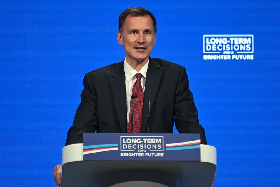 “I can confirm that whatever that recommendation, we will increase the National Living Wage to at least £11 per hour,” says Britain's Finance Minister Jeremy Hunt.