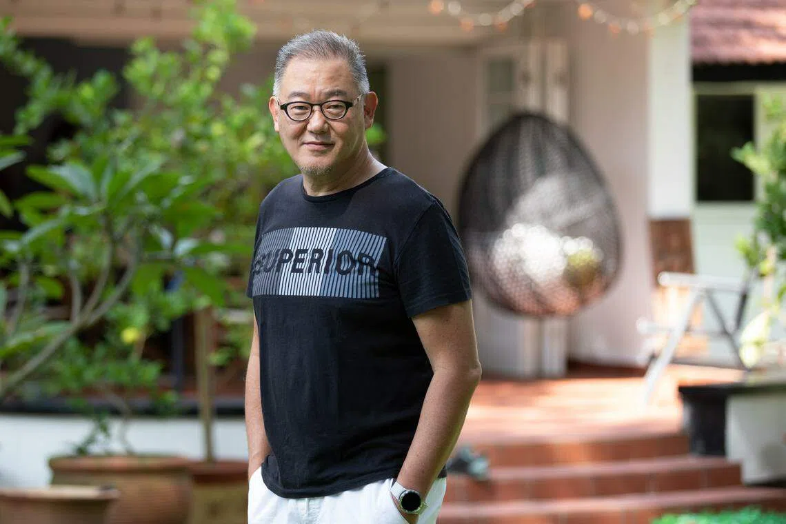 TJ Thang's black-and-white bungalow sits on some 30,000 square feet of land. 