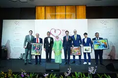 President Halimah Yacob (fourth from left) at Monday's May Day Charity event with the top sponsors of this year's benefit.