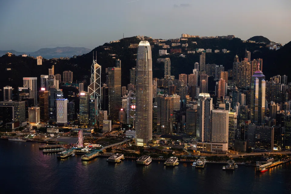 Hong Kong cut its economic growth forecast for the year as pandemic restrictions curb spending and the city faces higher interest rates.
