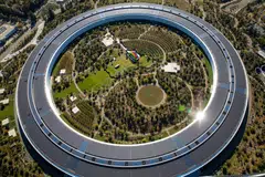 The iPhone maker is looking to limit expenditures and job growth at some of its divisions though Apple hasn't adopted a companywide policy.