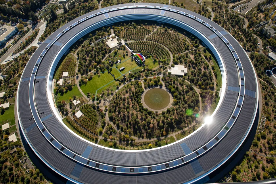 The iPhone maker is looking to limit expenditures and job growth at some of its divisions though Apple hasn't adopted a companywide policy.