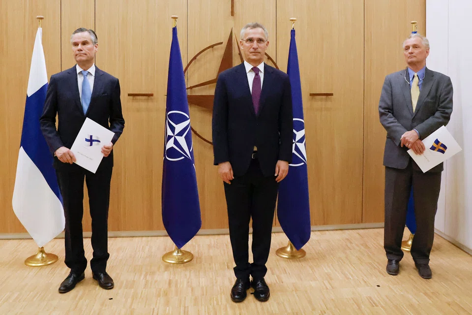 Finland's ambassador to Nato Klaus Korhonen, Nato Secretary-General Jens Stoltenberg and Sweden's ambassador to Nato Axel Wernhoff at a ceremony to mark Sweden's and Finland's application for membership in Brussels, on May 18, 2022. 