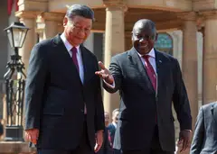 South Africa's President Cyril Ramaphosa welcomes China's President Xi Jinping ahead of the opening remarks of the Brics' emerging economies meeting.