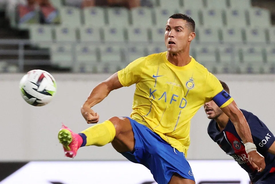 Football clubs in Saudi Arabia have signed a host of major stars beginning last year with Cristiano Ronaldo, pictured here playing for Al-Nassr in a pre-season club friendly against Paris Saint-Germain in July.