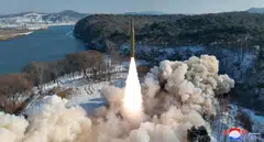 An intermediate-range solid-fuel ballistic missile, said to be solid-fuel and hypersonic, launches during a test at an unspecified location in North Korea in this picture released by the Korean Central News Agency on Jan 14, 2024.  