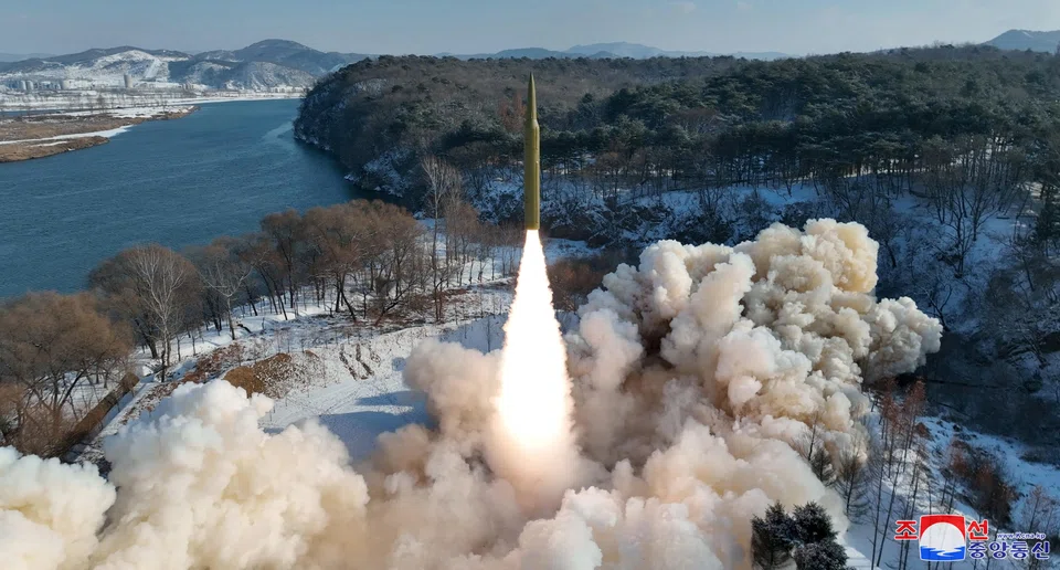 An intermediate-range solid-fuel ballistic missile, said to be solid-fuel and hypersonic, launches during a test at an unspecified location in North Korea in this picture released by the Korean Central News Agency on Jan 14, 2024.  