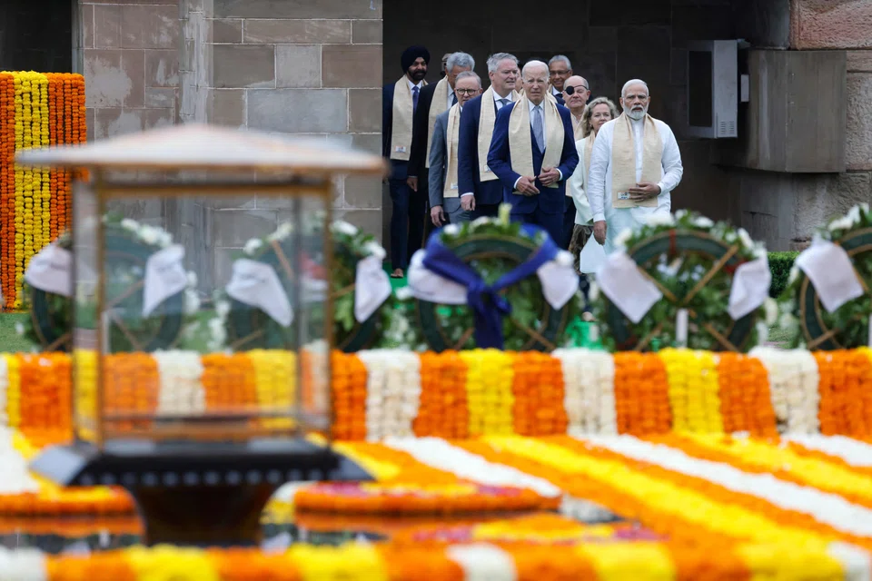 India's Prime Minister Narendra Modi , US President Joe Biden, German Chancellor Olaf Scholz and Australia's Prime Minister Anthony Albanese along with world leaders paying respect at the Mahatma Gandhi memorial on the sidelines of the G20 summit on Sunday.