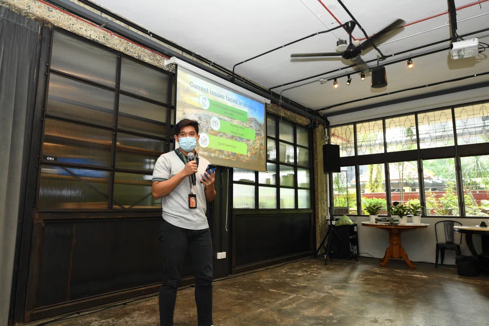 21-year-old Mohamad Iyan Danial, a team member of Reuse Only, presenting a solution to tackle plastic waste issues through vending machines.