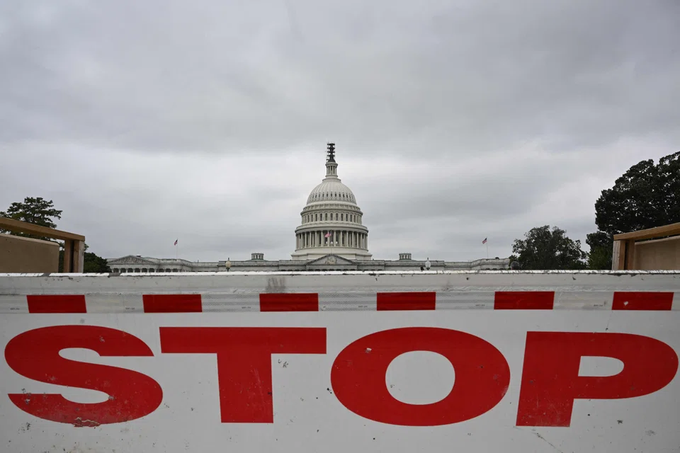 A traffic barrier is seen front of the dome of the US Capitol as a government shutdown looms in Washington, DC on Sept 28, 2023. 