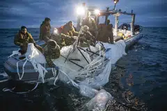US sailors recover remnants of a high-altitude surveillance balloon off the coast of Myrtle Beach, South Carolina, Feb 7, 2023. 