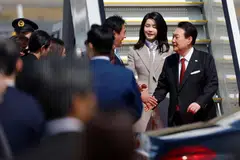 South Korea's President Yoon Suk Yeol and his wife Kim Keon Hee arrive at Haneda Airport in Tokyo, Japan March 16, 2023.