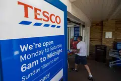 Tesco maintained its full-year profit guidance despite reporting a fall in UK sales in its latest quarter.