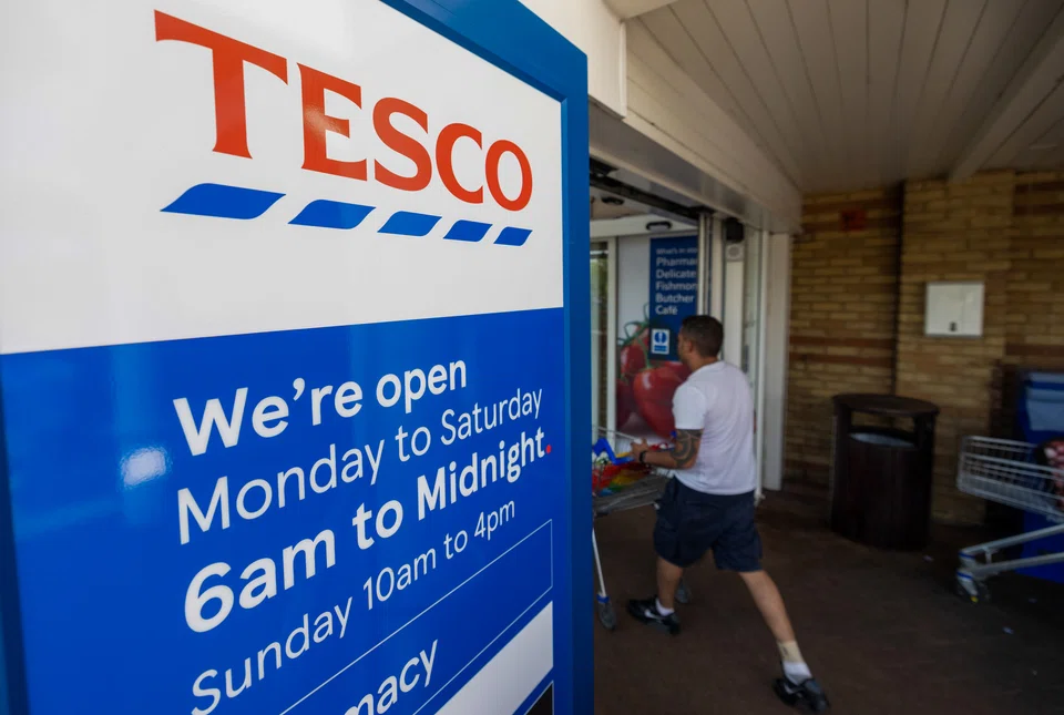 Tesco maintained its full-year profit guidance despite reporting a fall in UK sales in its latest quarter.