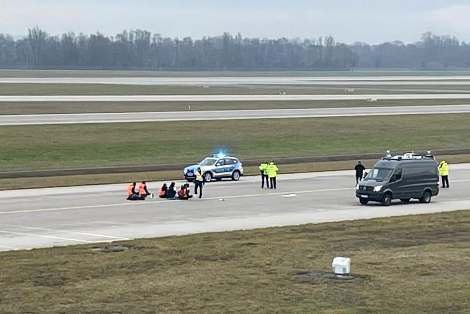 The protest marks the second time climate activists have penetrated security fences at Berlin airport in as many weeks.