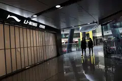 A closed Li-Ning store in  a shopping mall in Beijing, which has imposed curbs on people's movement to fend off a fresh wave of Covid-19 infections.   