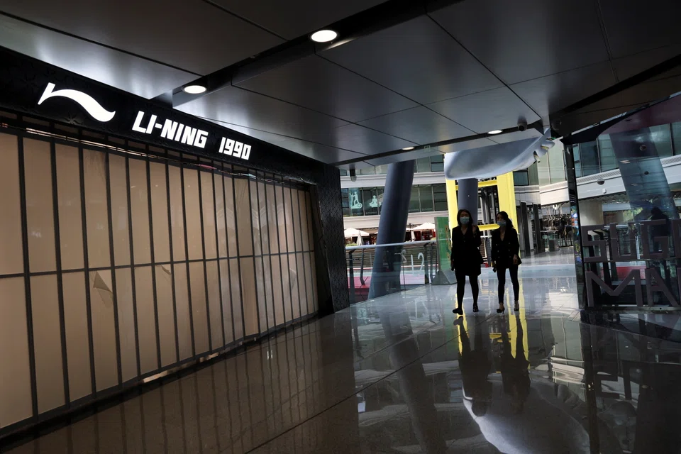 A closed Li-Ning store in  a shopping mall in Beijing, which has imposed curbs on people's movement to fend off a fresh wave of Covid-19 infections.   
