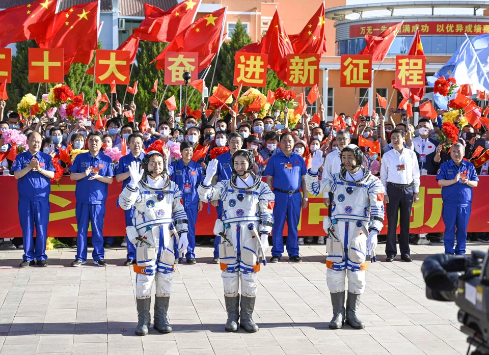 Three Chinese astronauts docked at the country's space station on Sunday, the state broadcaster said, marking a new milestone in Beijing's drive to become a major space power. 