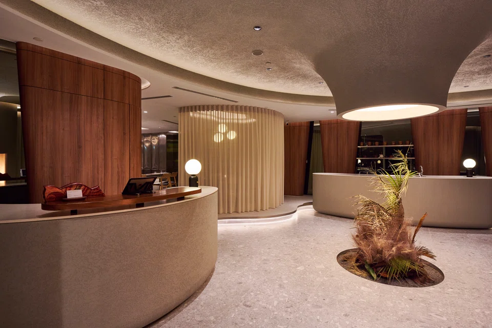 Seroja's minimalist interiors features a natural 'sculpture' of fresh and dried leaves.