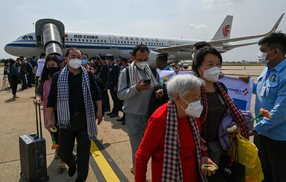 Chinese tourists are welcomed as they arrive at Phnom Penh International Airport in Phnom Penh, Cambodia on Feb 7, 2023. 