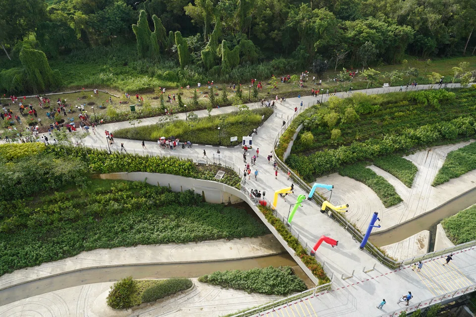 Incorporating rain gardens helped naturalise this concrete canal at Tampines. Such nature-based solutions are increasingly being used to create "green-grey" infrastructure to help cope with climate change. 