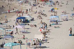 Many people crowded Sydney’s beaches or sought relief in the shade as authorities warned the most vulnerable - including the elderly and very young - to shelter in cool buildings.