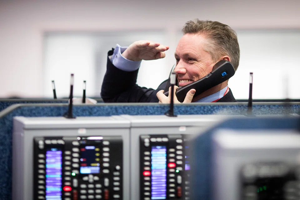 A trader at the London Metal Exchange (LME) in London. The demand by the exchange for details of private deals between its members and their clients is the first major move to increase oversight of global commodity markets. 

