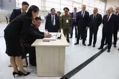 North Korean leader Kim Jong Un (third from left) signs the visitor's book during a visit along with Russian President Vladimir Putin (second right) to the Vostochny cosmodrome, outside the town of Tsiolkovsky, some 180km north of Blagoveschensk in Amur region, Russia, Sept 13, 2023. 