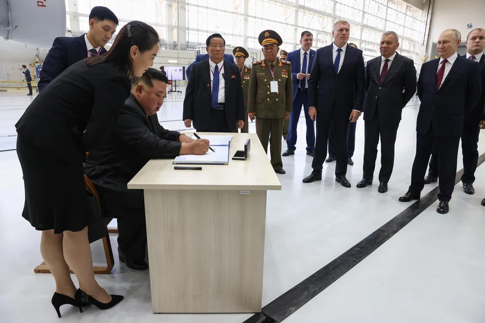 North Korean leader Kim Jong Un (third from left) signs the visitor's book during a visit along with Russian President Vladimir Putin (second right) to the Vostochny cosmodrome, outside the town of Tsiolkovsky, some 180km north of Blagoveschensk in Amur region, Russia, Sept 13, 2023. 
