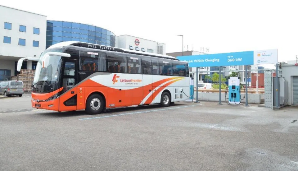 An electric bus, owned by Leisure Frontier Yutong, using the Shell Recharge 360kW proof-of-concept EV charging system in Woodlands.