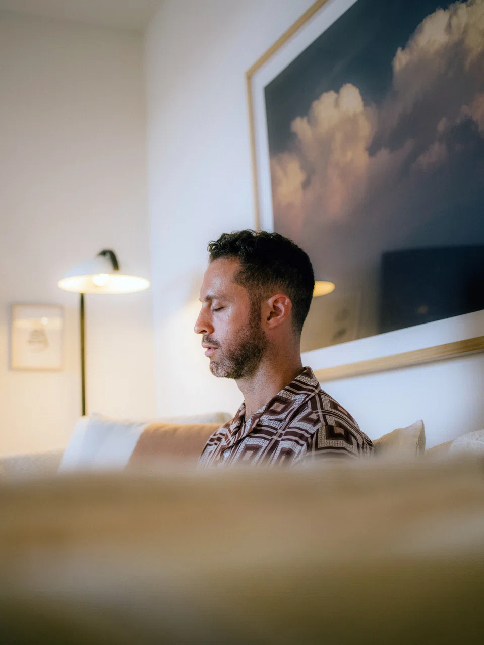 Jesse Israel, a meditation influencer and founder of the Big Quiet, at his home in Marina del Rey, California on Sept 26, 2022.  His soothing, emotive persona landed him on tour with Oprah Winfrey. Then during the pandemic, Israel began to suffer from debilitating depression.
