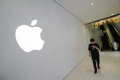 Apple fell 2.9 per cent on Thursday, its second straight decline, following reports that China has barred the use of iPhones in government offices.