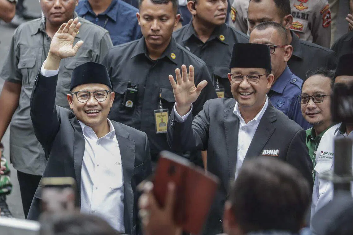 Anies (R) began his campaign by visiting homes in a densely populated area in the capital, Jakarta, promising to lower the prices of staples and to increase job opportunities.