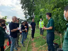 Bill Winters (second from left) and Patrick Lee (third from left), with Standard Chartered Bank's staff volunteers at Mandai Wildlife Reserve