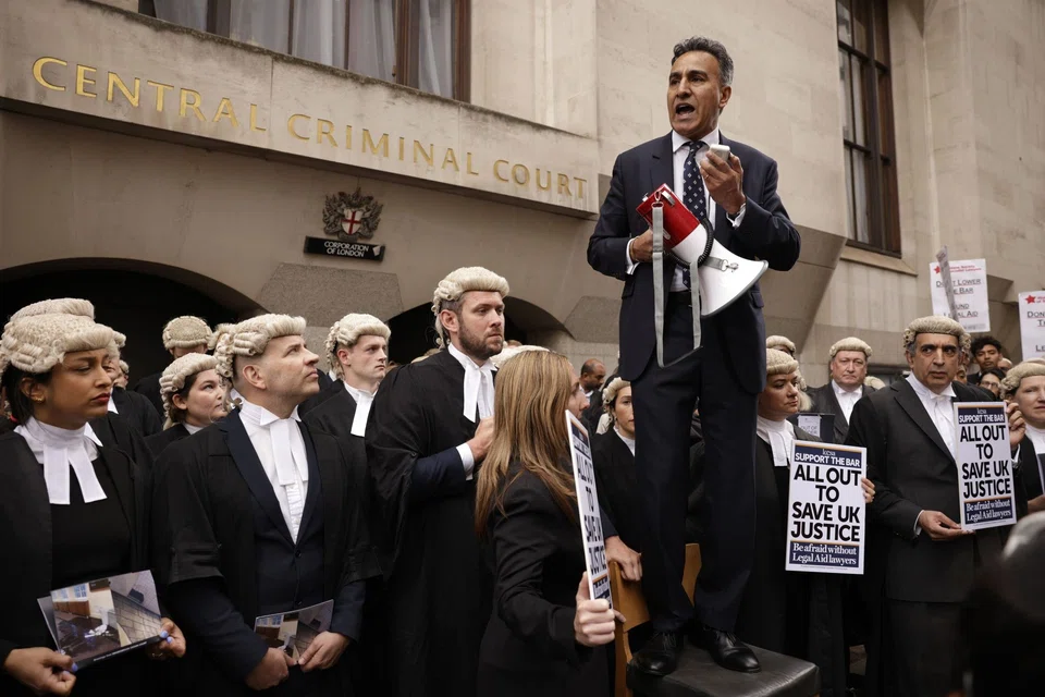Jo Sidhu, a barrister, speaks during a protest by criminal lawyers outside the Old Bailey law courts in central London on Monday (Jun 27). The Criminal Bar Association, which represents thousands of barristers in England and Wales, said around 80 per cent of its members backed the walkout that’ll target 14 days of strike action over the next month.  