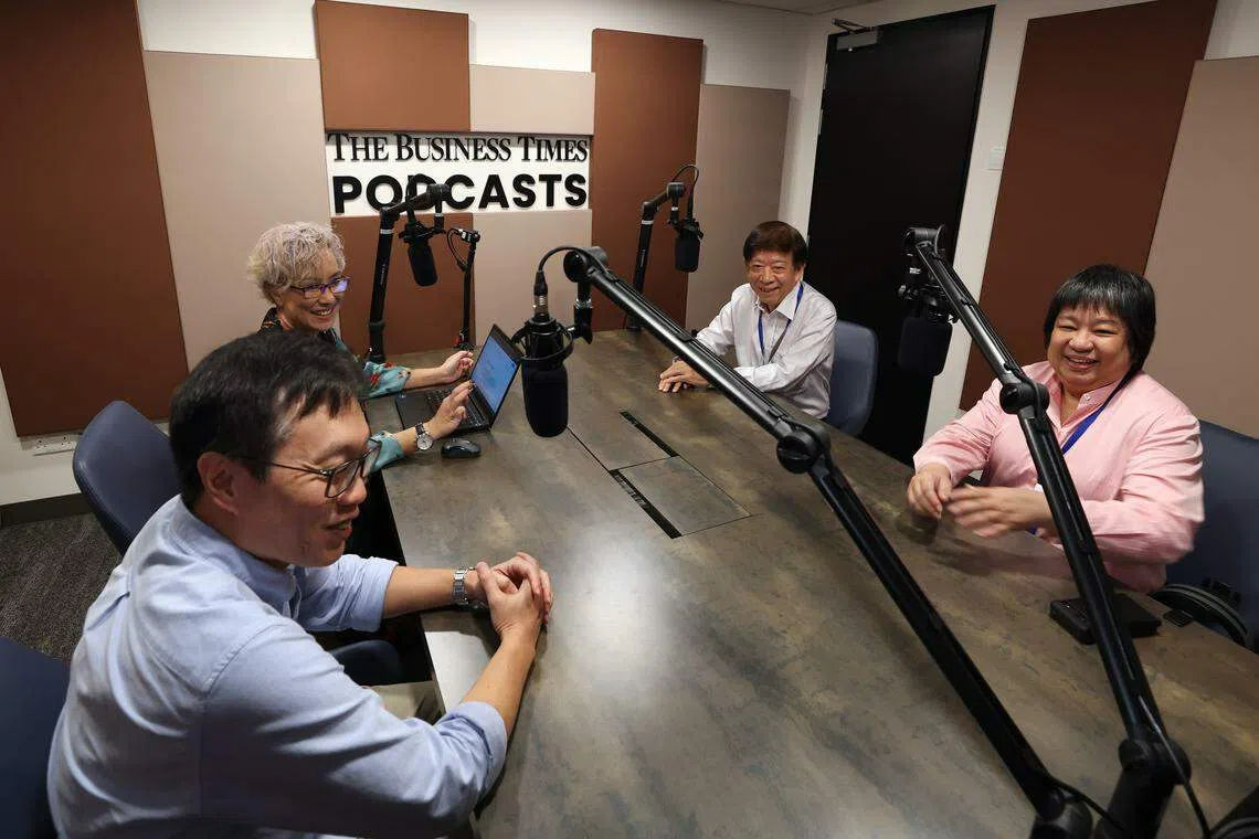 (Clockwise from bottom left) Wong Wei Kong, editor-in-chief of SPH Media's English/Malay/Tamil Media group, BT podcast editor Claressa Monteiro, SPH Media Trust chairman Khaw Boon Wan and SPH Media CEO Teo Lay Lim inside the newly built BT podcast studio.